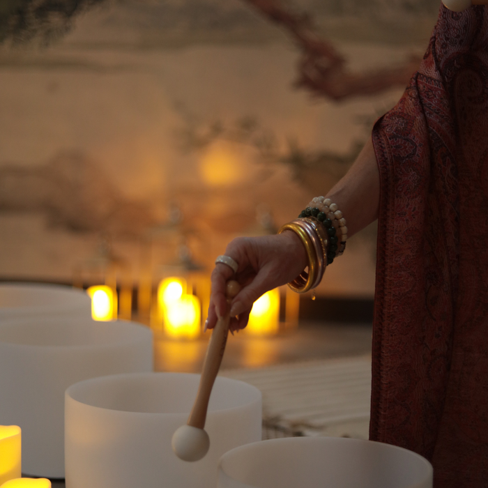 a person playing drums with candles