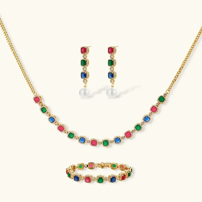 Jewel Royalty Multicolor CZ jewelry set with a gold-tone necklace and bracelet, colorful stones, and pearl-drop earrings