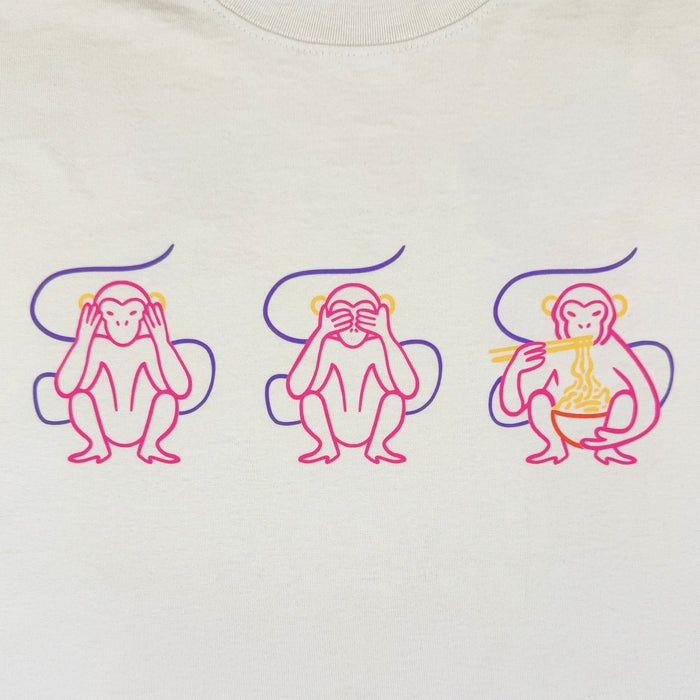 Featuring three cartoon monkeys—one covering its ears, one covering its eyes, and one eating noodles with chopsticks—this playful design puts a fresh spin on the classic “see no evil, hear no evil, speak no evil” motif. Outlined in vibrant pink and yellow lines on a crisp white background, the artwork was created for the Jo’s Modern Thai X Oaklandish Tee by Other, making it a standout choice for any heavyweight t-shirt collection.