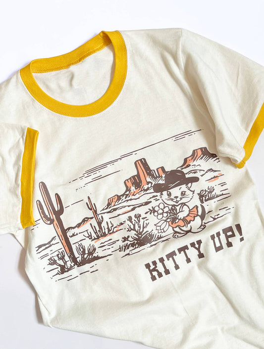 Cream yellow Kitty Up Ringer Tee shirt by The Coin Laundry featuring a funny cowboy cat design on the front.