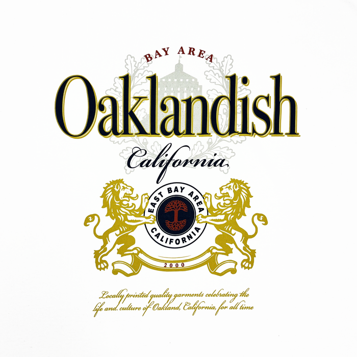 The Lager Especial Tee by Other is a 100% cotton classic fit featuring "Bay Area" over and "California" under stylized text. A central emblem reads "East Bay Area California 2000," flanked by golden lions, emphasizing local pride and heritage.