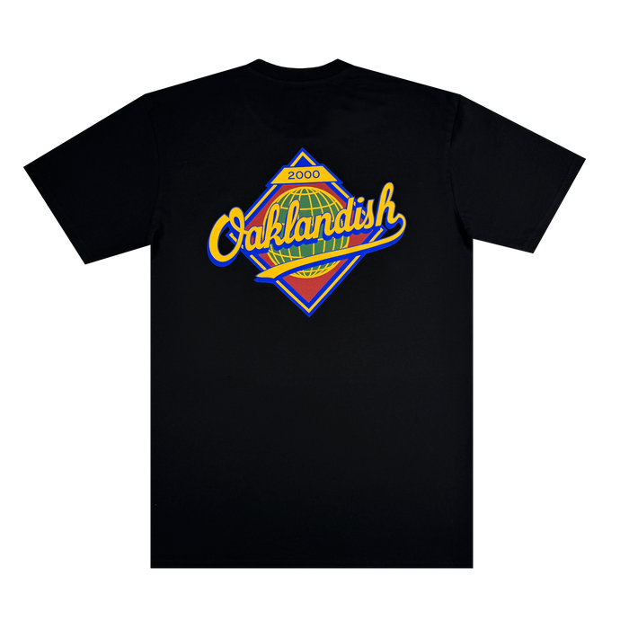 The Leadoff Tee by Other is a classic fit, 100% cotton black T-shirt showcasing a vibrant diamond-shaped logo on the back. “Oaklandish” is displayed in yellow cursive over a multicolored, stylized background with “2000” at the top. Blue, green, orange, and yellow accents create a bold look. Available in men’s sizing.