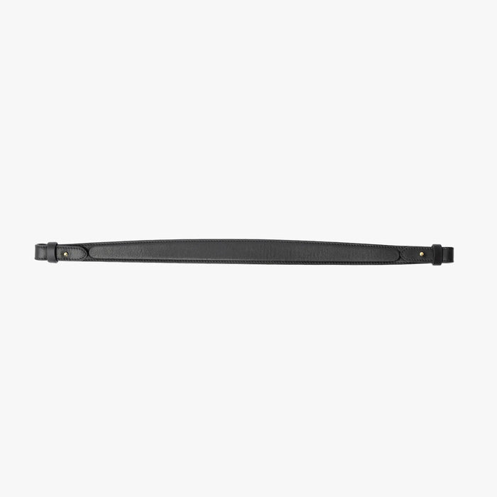 Detachable shoulder strap for STOW London's Curve, Midi Curve and East West in Black smooth leather on a light grey background featuring gold hardware