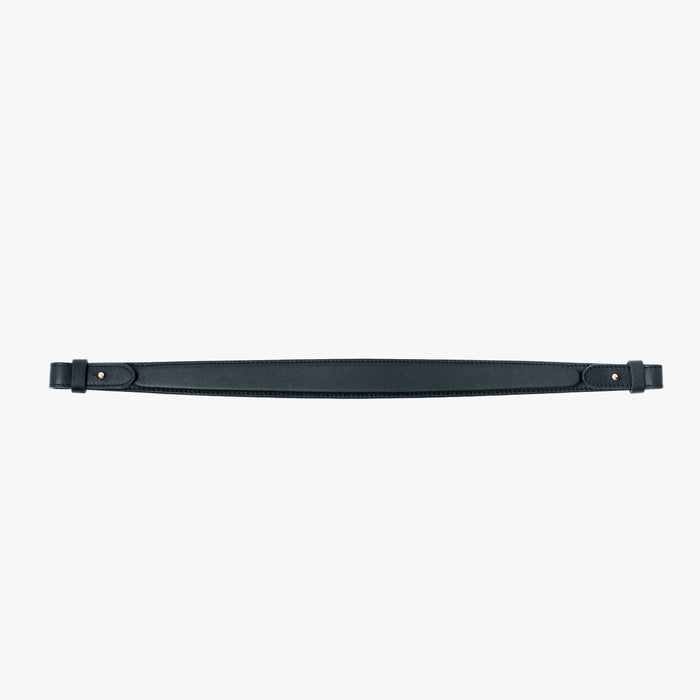 The detachable shoulder strap in New Forest smooth leather on a light grey background