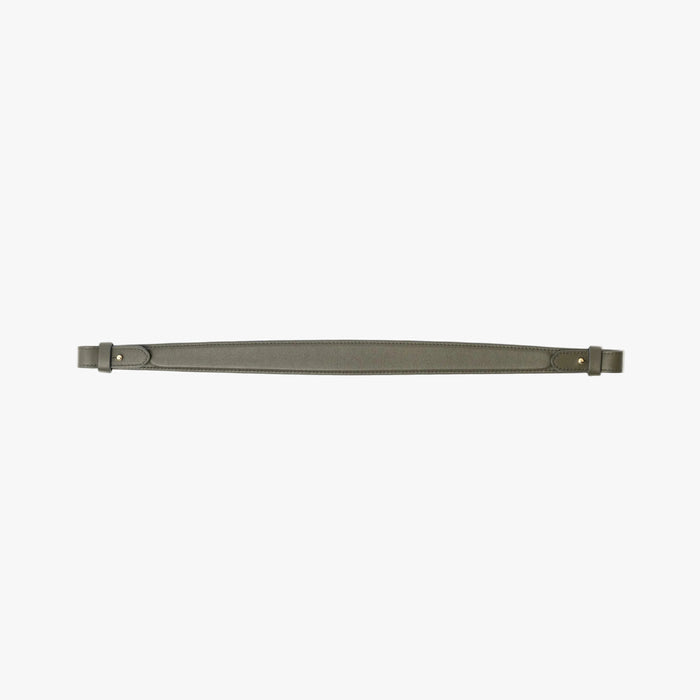 Detachable shoulder strap for STOW London's Curve, Midi Curve and East West in Dark Green smooth leather on a light grey background featuring gold hardware