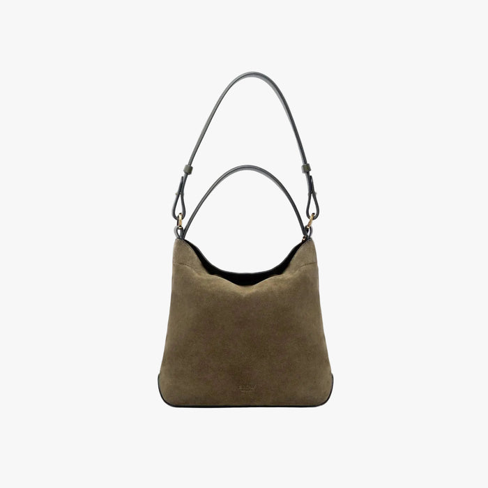 STOW London's Midi Curve in Dark Green suede leather on a light grey background featuring the detachable shoulder strap and top handle with gold hardware and details
