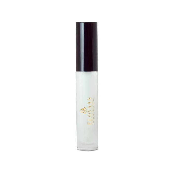 Lip Gloss - Clear in a transparent cylindrical tube with a dark cap and gold lettering, containing clear gloss.