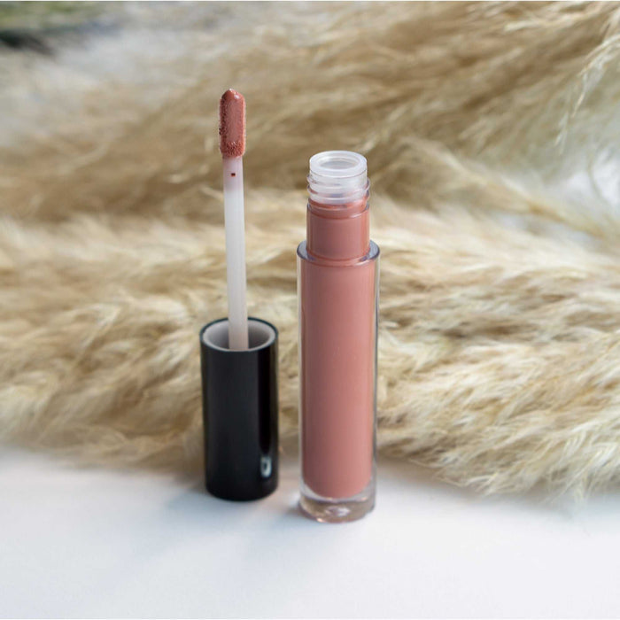 Lip Gloss - Clear in a rosy nude tube with a doe-foot applicator coated in pink gloss