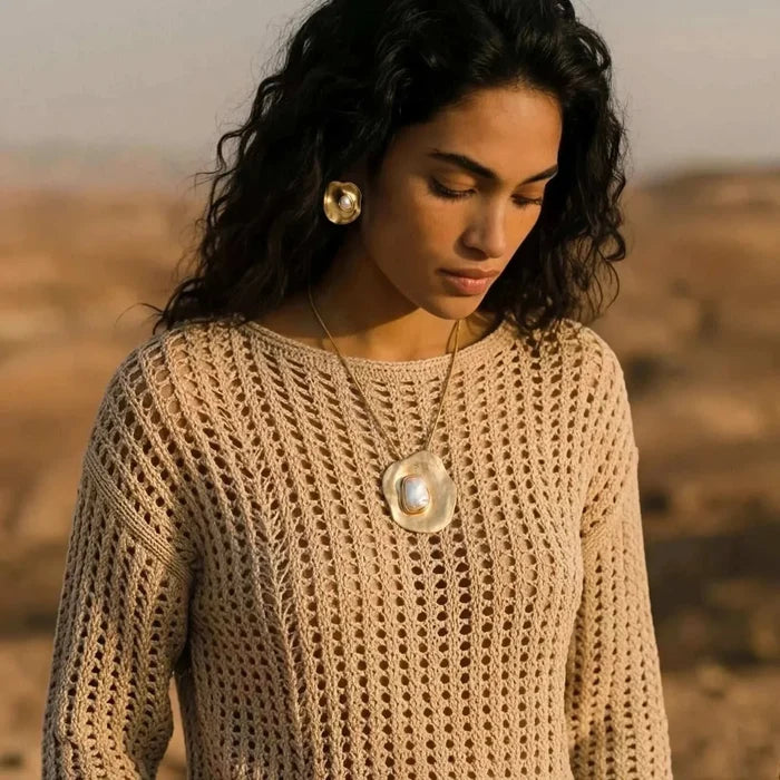 Liquid Art Sculptural Necklace with a large gold-tone pendant featuring an irregular ivory inset, paired with a matching stud earring