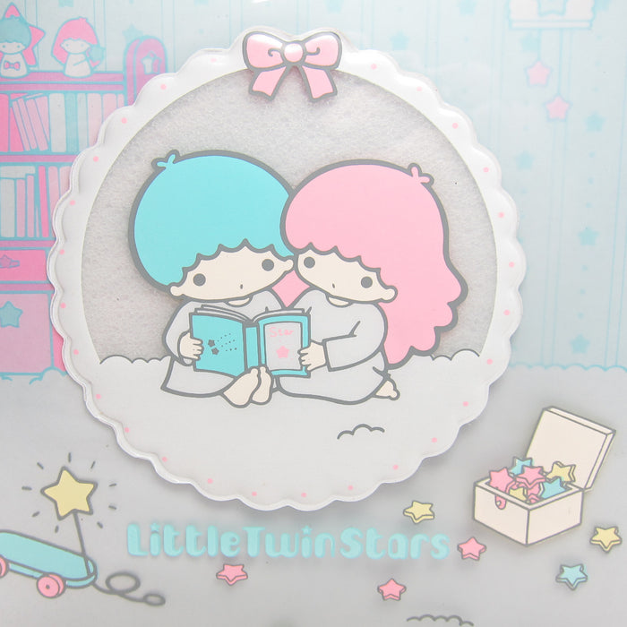 Raised 3D circle with Little Twin Stars Kiki and Lala reading a book