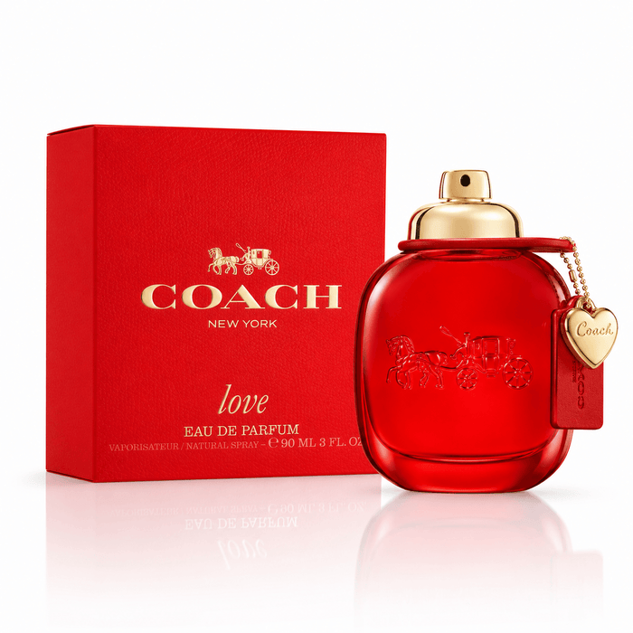 Coach Love EDP red glass perfume bottle with gold-toned cap and heart-shaped charm beside a matching red box