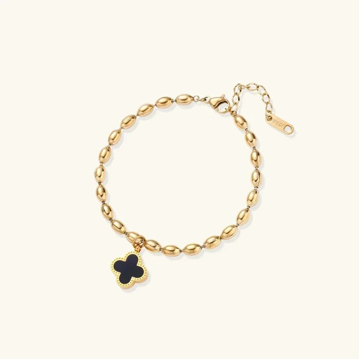 Lucky Clover 18K Gold-Plated bracelet with a gold-tone oval-bead chain and black four-leaf clover charm edged in gold