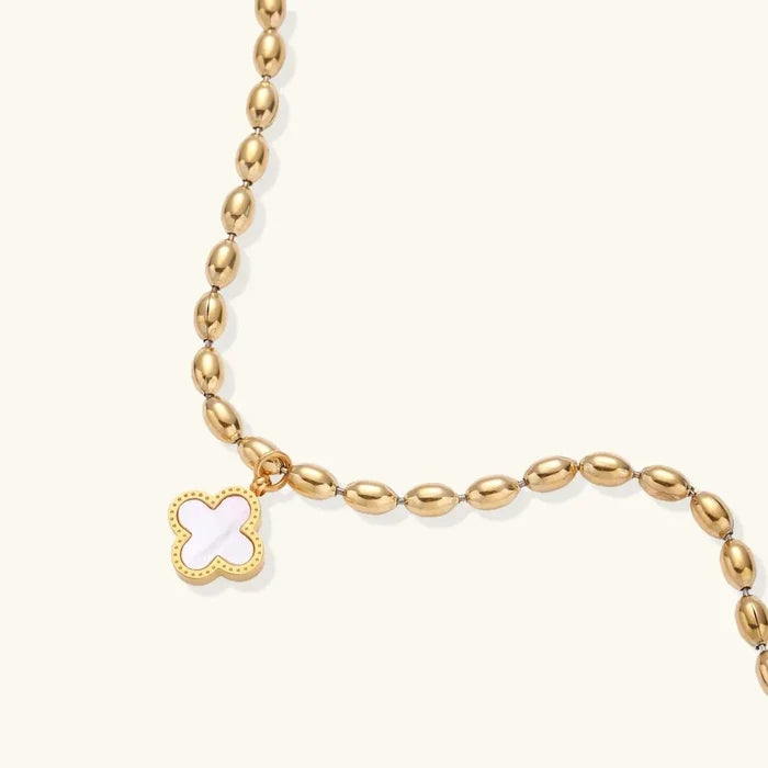 Lucky Clover 18K Gold-Plated bracelet with a gold-tone oval-bead chain and white clover charm edged in dotted gold