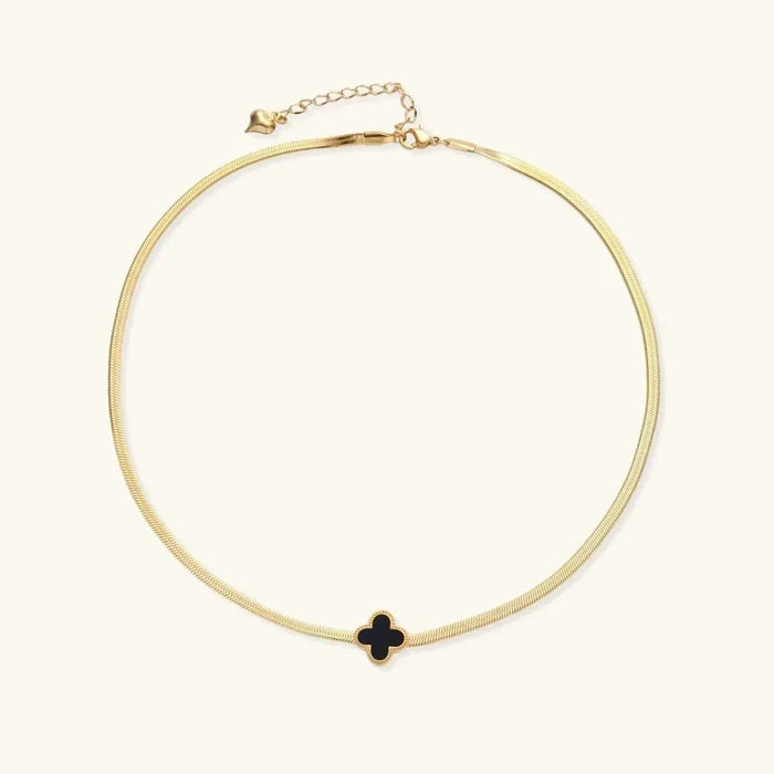 Lucky Clover Black Enamel necklace with a small black four-leaf clover pendant in a gold-tone bezel and fine gold chain