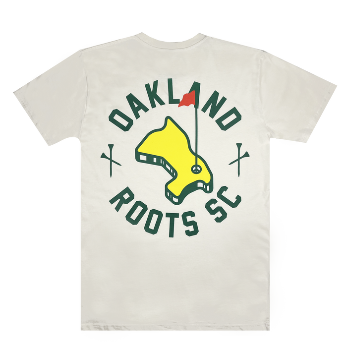 The "Members Only Tee" by Oakland Roots SC features a white base with a yellow and green map graphic at the center, topped with a red flag. Encircling the graphic, the words "OAKLAND ROOTS SC" are displayed in green text, accompanied by two crossed green golf clubs on either side of the map, symbolizing Oakland Roots' dedication to social good.