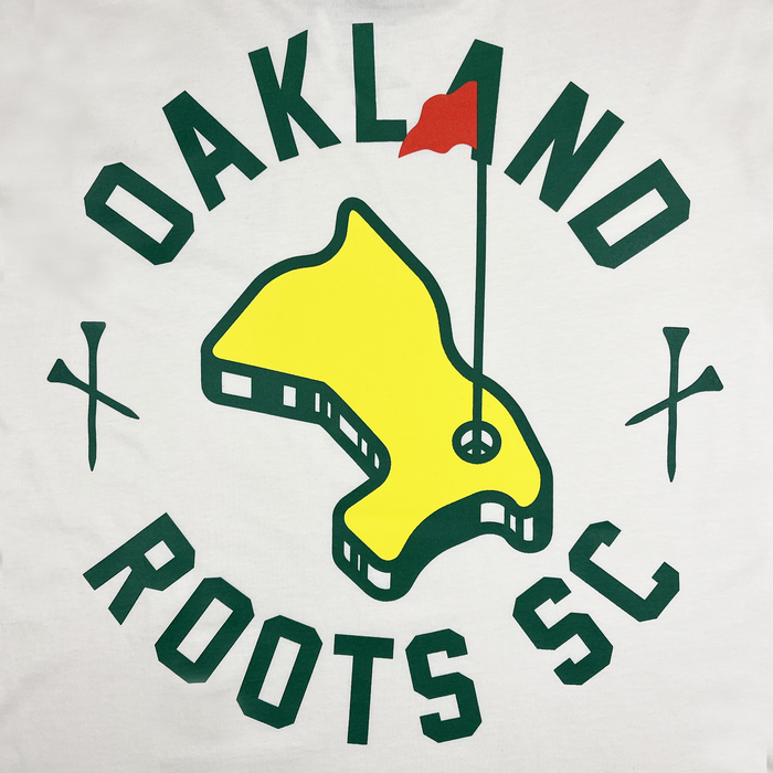 Oakland Roots SC Members Only Tee: Showcases a stylized yellow map of Oakland with a red flag pin in the center, encircled by the words "OAKLAND ROOTS SC" in green text on a white background. The map is flanked by two green crossed objects resembling stadium floodlights, representing social good.