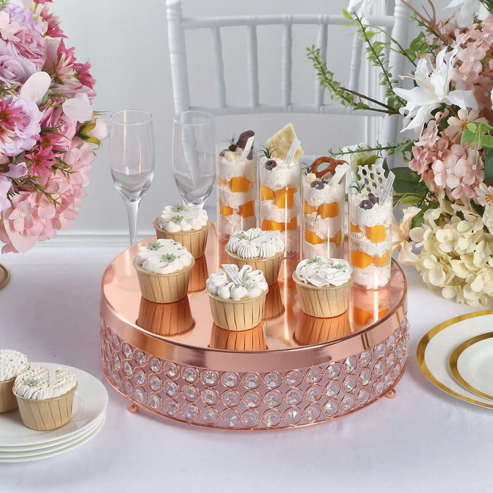 Elegant dessert display with cupcakes and parfaits on a rose gold stand.