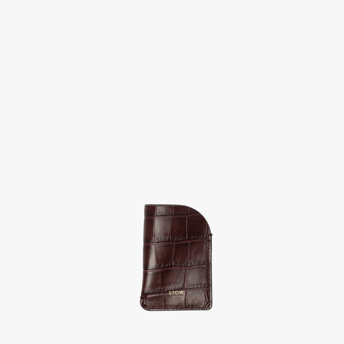 STOW London's Mini Cardholder in Burgundy Embossed Croc leather on a light grey background featuring a small gold embossed logo on the front bottom