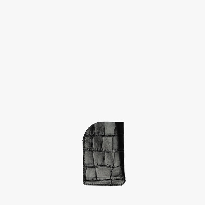 Back panel of STOW London's Mini Cardholder in Black Embossed Croc leather on a light grey background