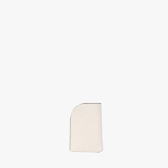 Back panel of STOW London's Mini Cardholder in Spring Moon pebbled leather on a light grey background