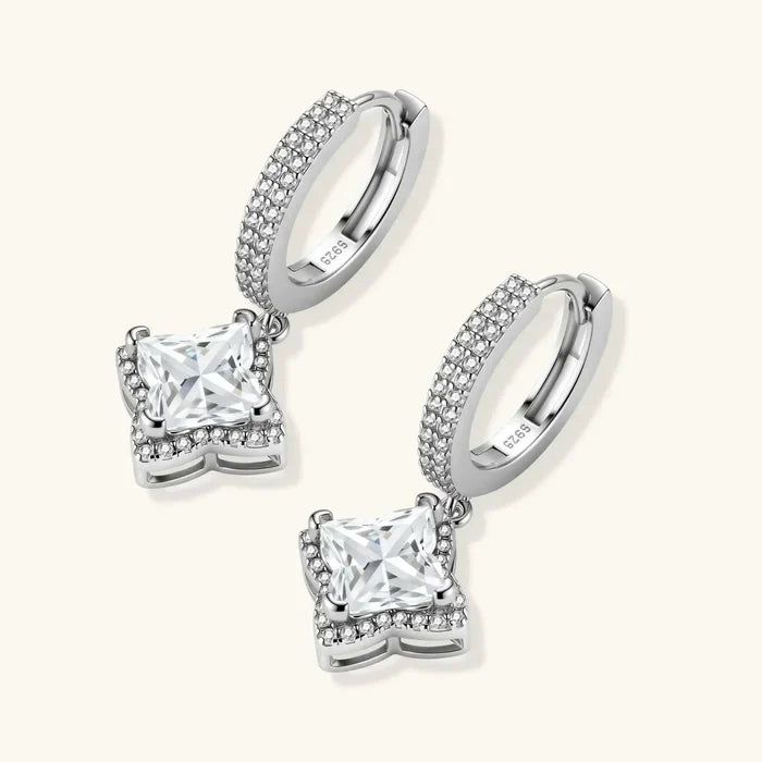 Moissanite Star Halo Dangle Huggie Earrings in silver-toned metal with crystal-set hoops and square stones in star halos