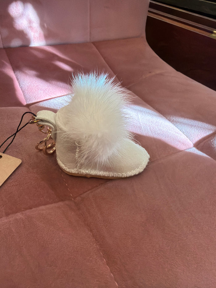 Joia Mukluk keychain bag charm featuring a colorful, plush Mukluk design with decorative details.