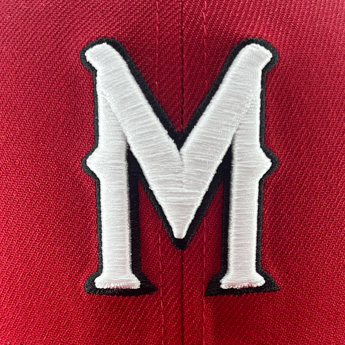 Detailed view of red 59fifty fitted hat with Diablos logo in white embroidery.