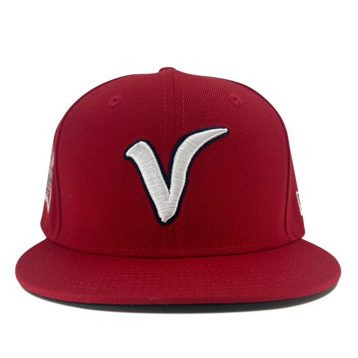 Front view of red New Era 59fifty fitted hat with El Aguila logo and red bill.