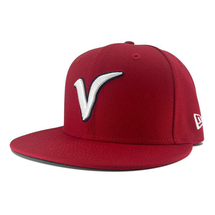 Side view of red New Era 59fifty fitted hat with Away El Aguila logo , red bill, and New Era Flag logo.