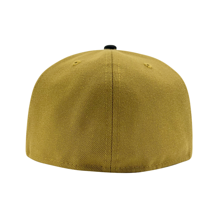A New Era Official 59FIFTY Fitted Cap in mustard yellow is displayed from the back against a plain white background. The cap features visible stitching down the center and sides, two small ventilation holes on each side, and a black button on top. The brand is listed as “Other.”.