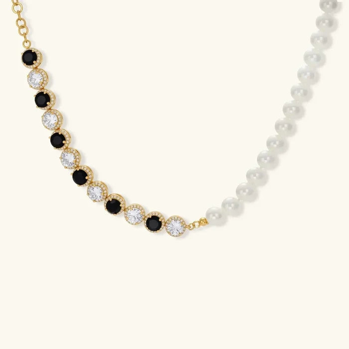 Noir Luxe Black & Clear necklace with alternating black and clear haloed stones, gold-tone settings and white pearls