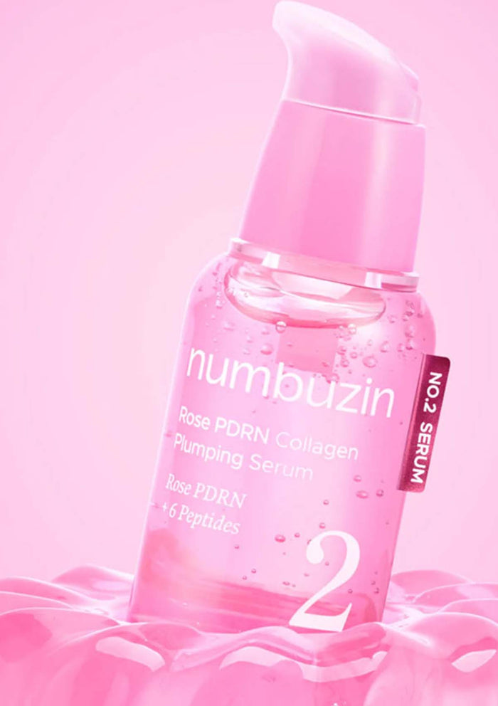 Pink serum bottle with 'numbuzin' branding on a pink background