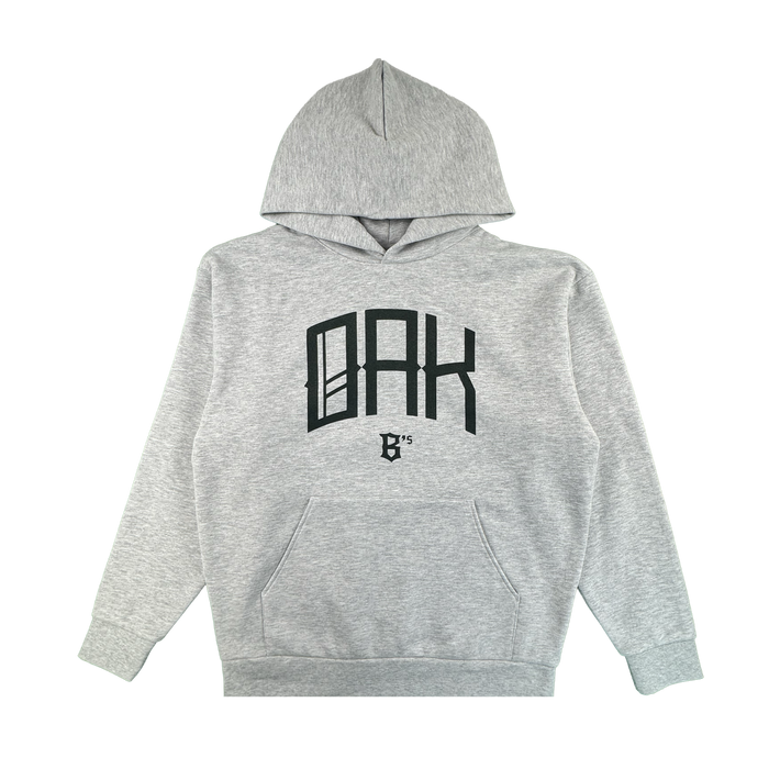 The Oakland Ballers OAK Ballers Hoodie is a light gray hoodie with a front pocket, featuring bold black "OAK" text in a modern font and a small "B '15" graphic on the chest. The background is plain white.