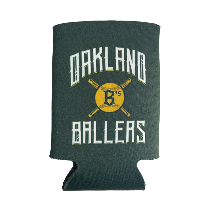 Image of a green foam can cooler, named "Oakland Ballers 12oz Can Cooler" by the Oakland Ballers brand, featuring the text "OAKLAND BALLERS" in a white old-English font. Between the words is a yellow baseball with the letter "B's" and two crossed bats behind it, celebrating the new professional baseball team in the Pioneer League. The can cooler has a cutout at the bottom to accommodate the base of a can.