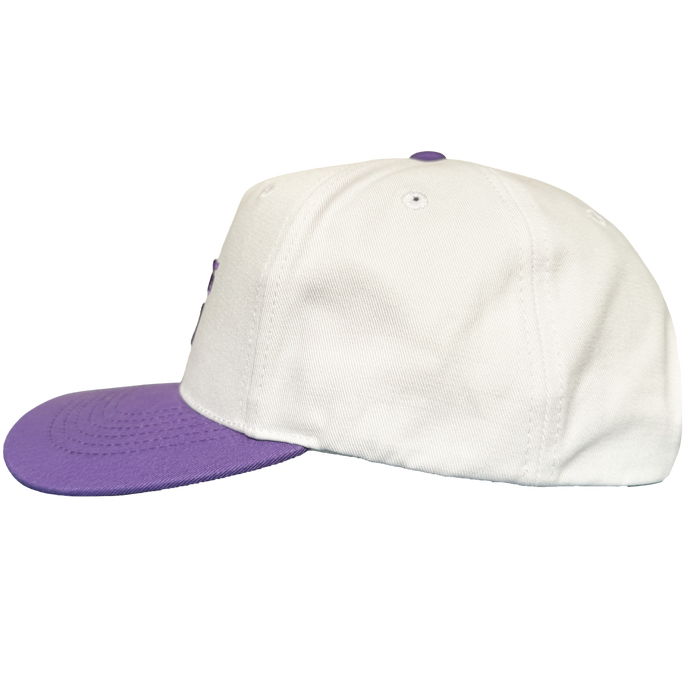 The Oakland Ballers 5 Panel Cap by Oakland Ballers is a white snapback hat featuring a purple brim and button, displayed from the side against a plain white background. The cap includes visible stitching and ventilation eyelets on the crown, with no visible logos or designs from the Oakland Ballers or any other Oakland baseball team on this side.