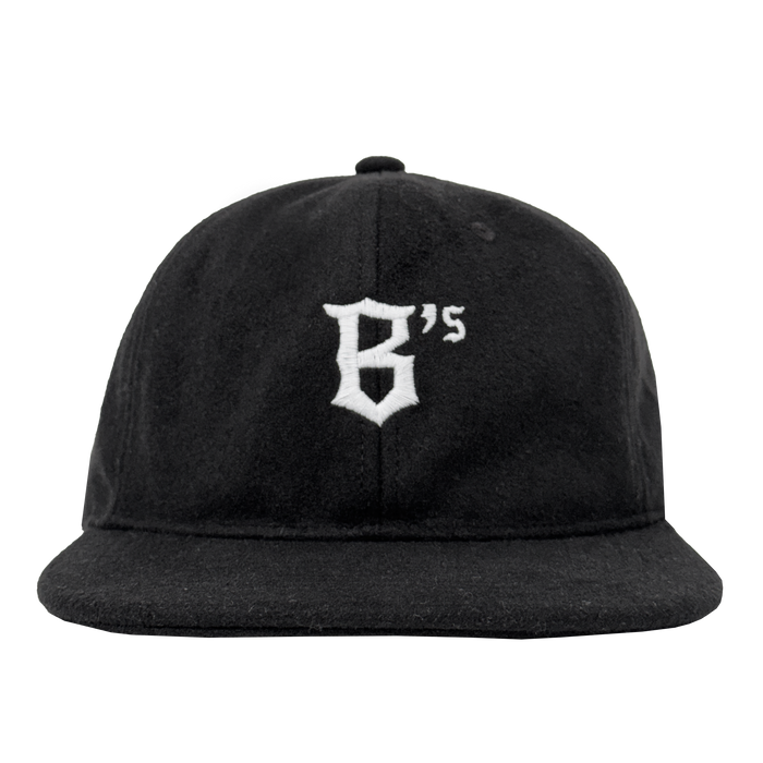 The Oakland Ballers B Strapback is a black hat with a flat brim and an embroidered white gothic-style “B” on the front. An adjustable strapback offers comfort. Shown from the front on a plain white background. Brand: Oakland Ballers.