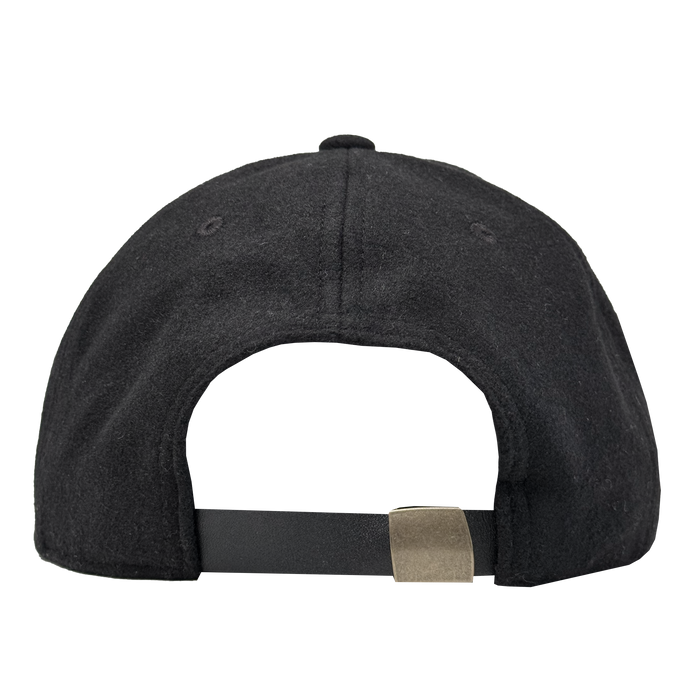 The image shows the back view of the Oakland Ballers B Strapback by Oakland Ballers. This black cap features an adjustable strapback with a metallic buckle, two eyelet holes on each side, and soft, slightly textured fabric.