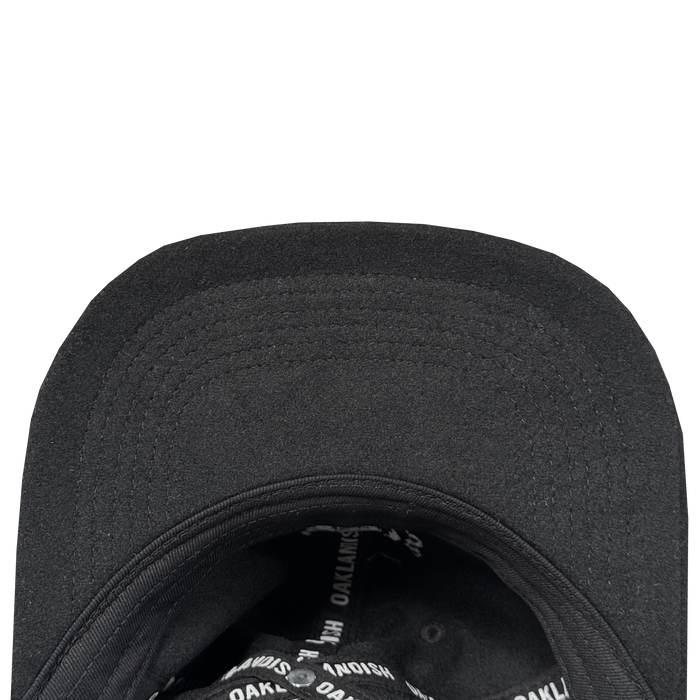 Close-up of the Oakland Ballers B Strapback underside with a curved brim and interior lining. The black sweatband area features repeated white "OAKLAND BALLERS" branding. The hat is shown against a white background.