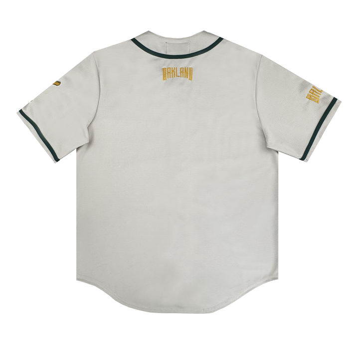 The Oakland Ballers Button Up Jersey is a white shirt with green trim inspired by the Pioneer League, perfect for Oakland Ballers fans.
