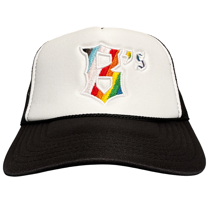 The Oakland Ballers Pride Trucker is a white and black hat with a bold, rainbow-embroidered "B" and small "'s" on the front—perfect for fans of classic Oakland baseball style.