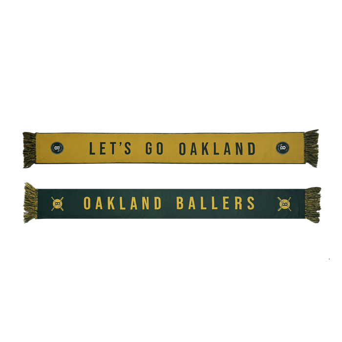 The Oakland Ballers Scarf, by Oakland Ballers, features two woven designs: one gold with "LET'S GO OAKLAND" in black; the other green with "OAKLAND BALLERS" and crossed bats at each end. Both have fringe ends, perfect for fans.