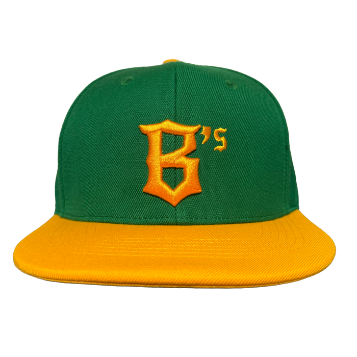 The Oakland Ballers Snapback by Oakland Ballers is a green cap with a bright yellow brim and a bold yellow "B’s" logo on front, representing the team. A plain white background highlights its vivid colors and sharp design.