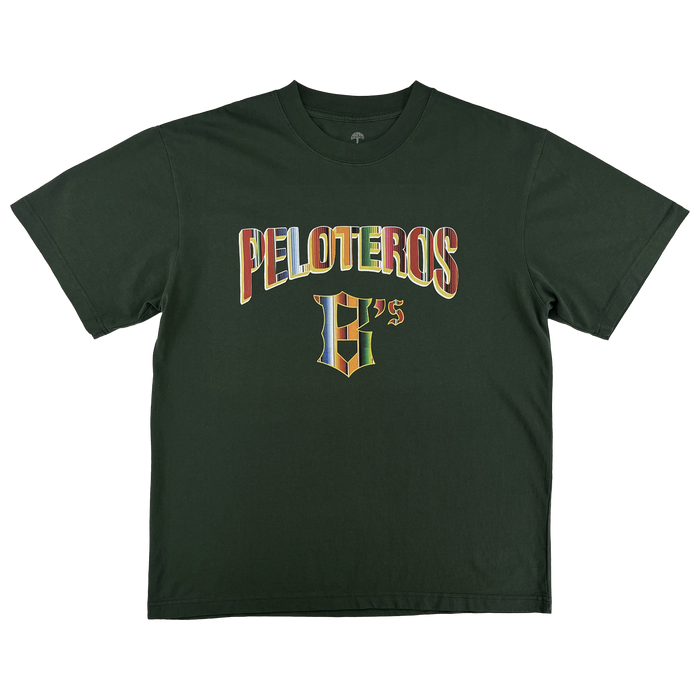 The Oakland Ballers Oakland Beisbol Tee is a dark green short-sleeve shirt featuring "PELOTEROS" and a stylized "G’s" in multicolored varsity-style letters—a tribute to the team—shown laid flat on a white background.