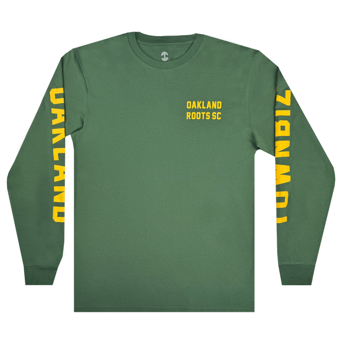 The Oakland Roots SC Classic 2.0 LS Tee is a green long-sleeve shirt by Oakland Roots SC, featuring yellow “OAKLAND ROOTS SC” print on the chest and bold vertical “OAKLAND” and “TOWN BIZ” text down each sleeve.