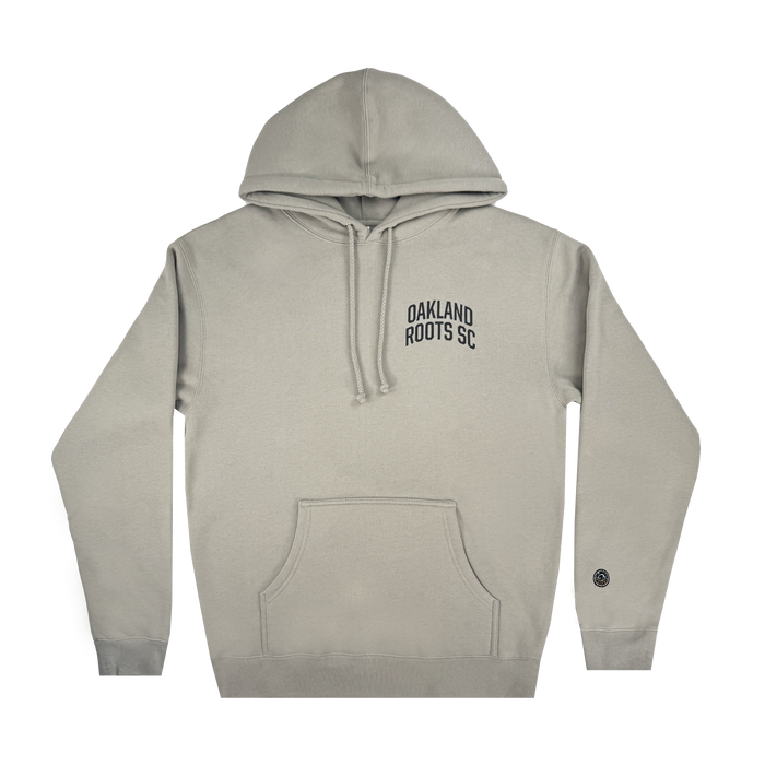 The Oakland Roots SC Classic Hoodie by Oakland Roots SC showcases a light gray design with a front pocket and drawstring hood, "Oakland Roots SC" on the left chest, and a small circular black patch on the lower right sleeve, combining Soul style with comfort.