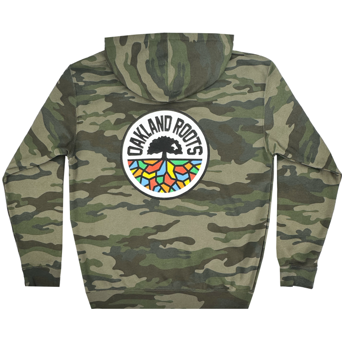 The Oakland Roots SC Classic Zip Hoodie by Oakland Roots SC features a camouflage design with a bold back logo: "OAKLAND ROOTS" encircles a black tree with vibrant roots in green, blue, orange, and red on white. A long-sleeved piece with a drawstring hood combines sports club style and comfort.