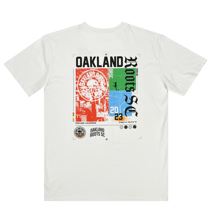 Introducing the Oakland Roots SC Futbol Town Tee by Other—a white t-shirt featuring a vibrant graphic on the back. The design showcases “Oakland Roots SC,” a Ferris wheel, airplane, sun, “2023,” and iconic Oakland landmarks in bold red, blue, and green hues. Official team logos and Oakland Roots Sports Club text are displayed at the bottom.