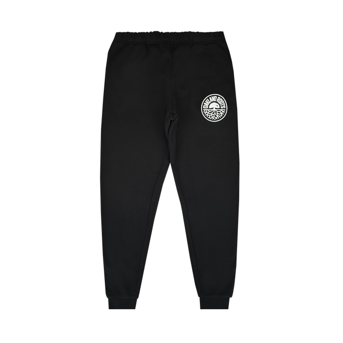 The Oakland Roots SC University Pant for men features an elastic waistband and cuffs, a relaxed fit, and a white Oaklandish tree logo on the left thigh. Displayed flat on a white background. Brand: Oakland Roots SC.