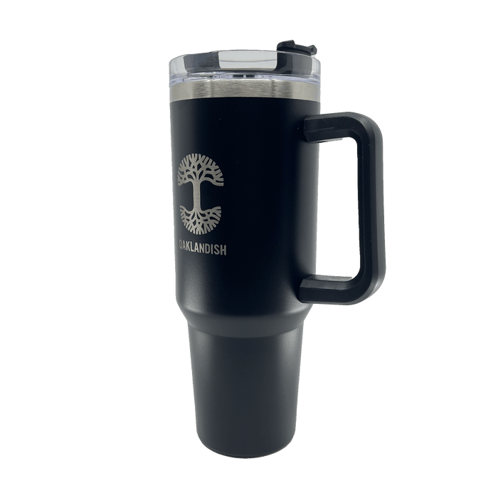 Side view of a black double walled 40-oz stainless steel travel drink tumbler with silver Oaklandish log and wordmark and airtight lid.