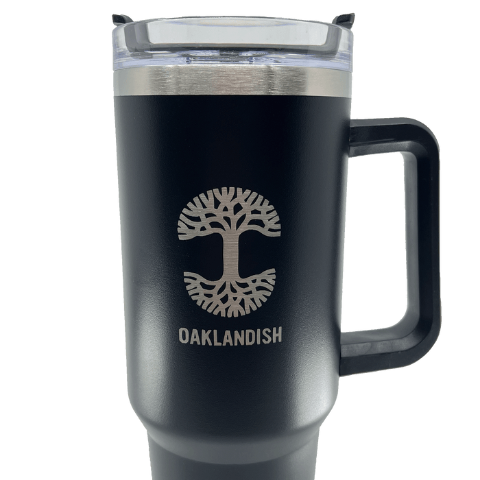 Close up of the Oaklandish logo and wordmark on a black double walled 40-oz stainless steel travel drink tumbler.